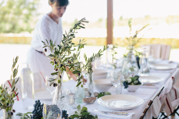 Setting_table_behind_olive_branch